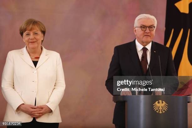 Education and Germany Chancellor Angela Merkel listens to Germany President Frank-Walter Steinmeier as she takes her oath to serve as Chancellor...