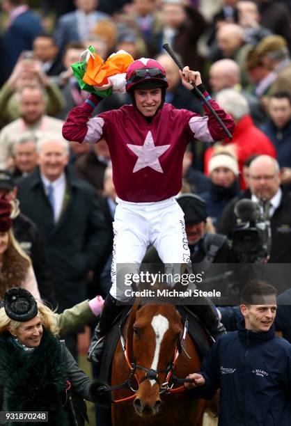 Jack Kennedy ridding Samcro celebrates after winning Ballymore Novices' Hurdle during Cheltenham Festival Ladies Day at Cheltenham Racecourse on...