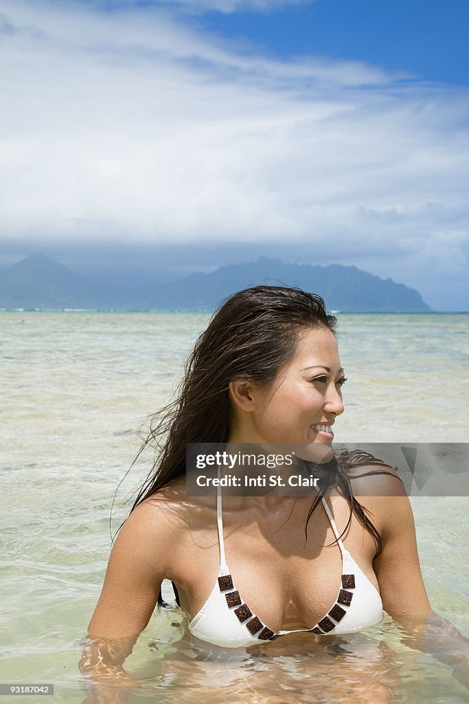 Happy woman swimming in the ocean