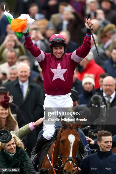 Jack Kennedy ridding Samcro celebrates after winning Ballymore Novices' Hurdle during Cheltenham Festival Ladies Day at Cheltenham Racecourse on...