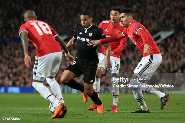 Luis Muriel of Sevilla battles with Ashley Young of Man Utd , Jesse Lingard of Man Utd and Chris Smalling of Man Utd during the UEFA Champions League...