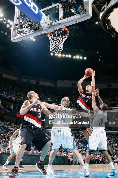 Brandon Roy of the Portland Trail Blazers puts up shot between Sean Marks and Chris Paul of the New Orleans Hornets during the game on November 13,...