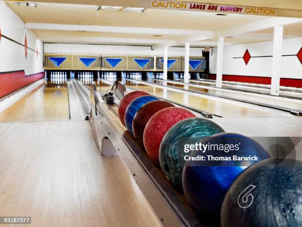 selection of bowling balls in bowling alley - bowling alley fotografías e imágenes de stock