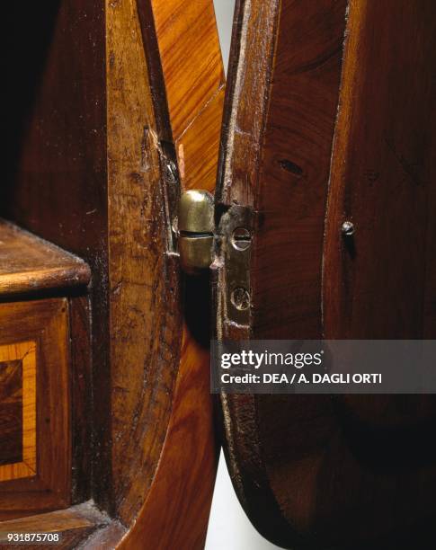 Drop leaf hinge on a Louis XV-style bois de rose, bois de violette and rosewood Trumeau made in Genoa. Italy, 18th century. Detail.