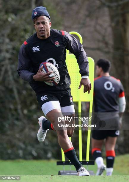 Anthony Watson runs with the ball during the England training session held at Pennyhill Park on March 14, 2018 in Bagshot, England.