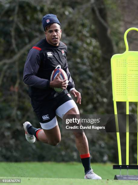 Anthony Watson runs with the ball during the England training session held at Pennyhill Park on March 14, 2018 in Bagshot, England.