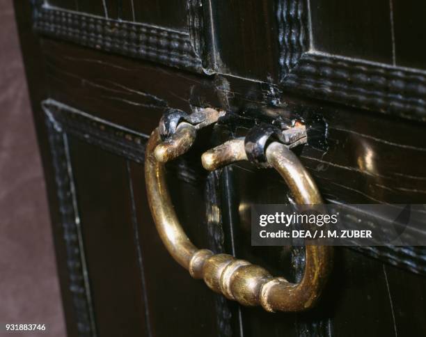 Handle of a spruce and oak travel cabinet with ebony, tortoiseshell and rosewood veneer and ivory inlays, made in Antwerp. Belgium, 17th century....