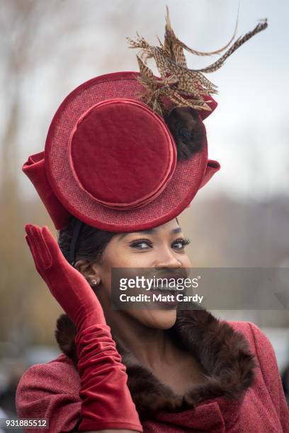Lystra Adams poses for a photograph as she arrives for Ladies Day at Cheltenham Racecourse on March 14, 2018 in Cheltenham, England. Thousands of...