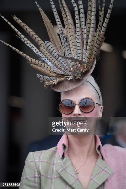 Racegoer poses for a photograph as she arrives for Ladies Day at Cheltenham Racecourse on March 14, 2018 in Cheltenham, England. Thousands of racing...
