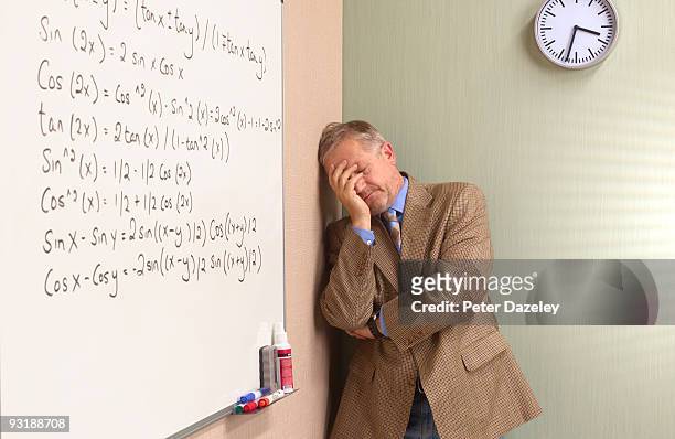mature depressed maths teacher - sin esperanza fotografías e imágenes de stock