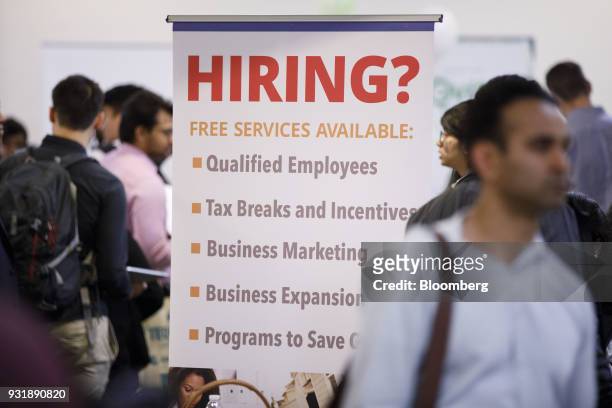 Hiring" sign is displayed during the TechFair LA career fair in Los Angeles, California, U.S., on Thursday, March 8, 2018. The U.S. Department of...
