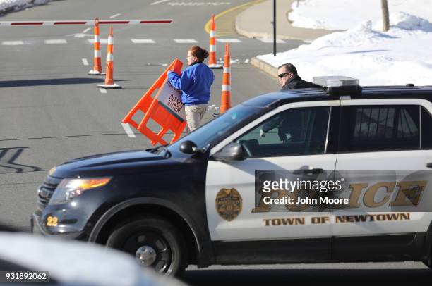 Police lock down the campus of Newtown High School as students prepared to take part in the National School Walkout on March 14, 2018 in Sandy Hook...