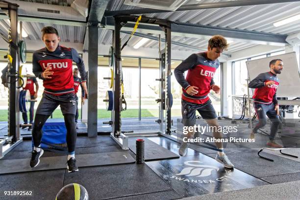 Connor Roberts, Daniel James and Leon Britton exercise in the gym during the Swansea City Training at The Fairwood Training Ground on March 13, 2018...