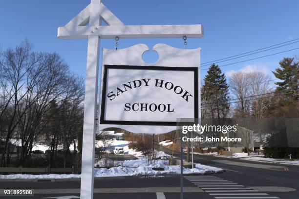 Sign stands near the site of the December 2012 Sandy Hook school shooting on the day of the National School Walkout on March 14, 2018 in Sandy Hook...