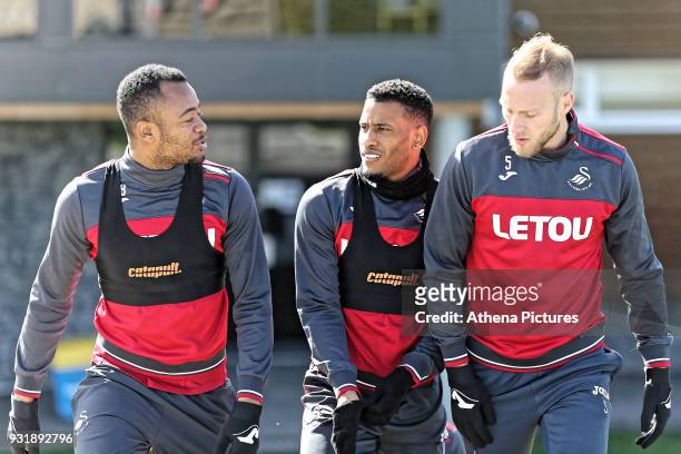 Jordan Ayew, Luciano Narsingh and Mike van der Hoorn walk to the pitch during the Swansea City Training at The Fairwood Training Ground on March 13,...