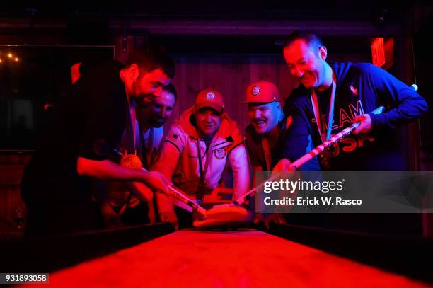 Casual portrait of Team USA John Landsteiner, Joe Polo, John Shuster, Matt Hamilton, and Tyler George playing shuffleboard during photo shoot at...