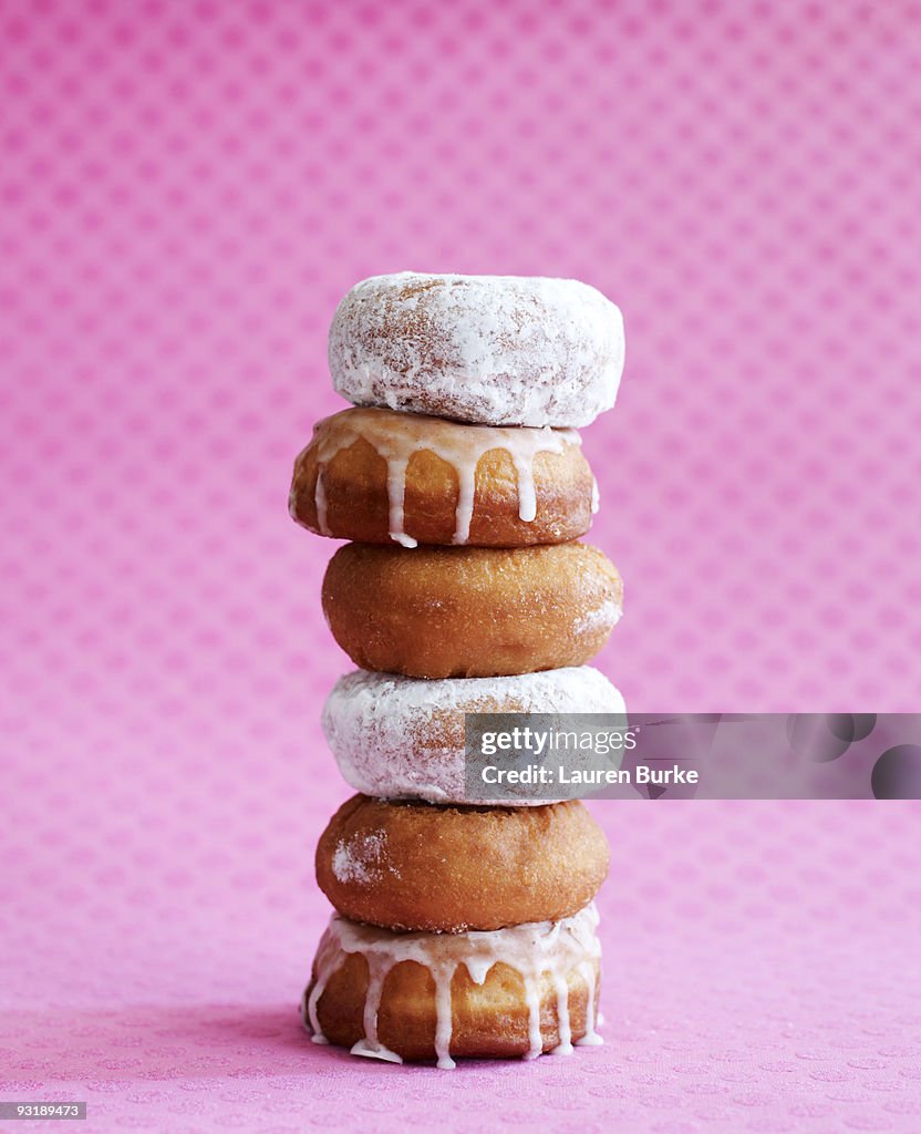 Stack of Donuts on Pink Background