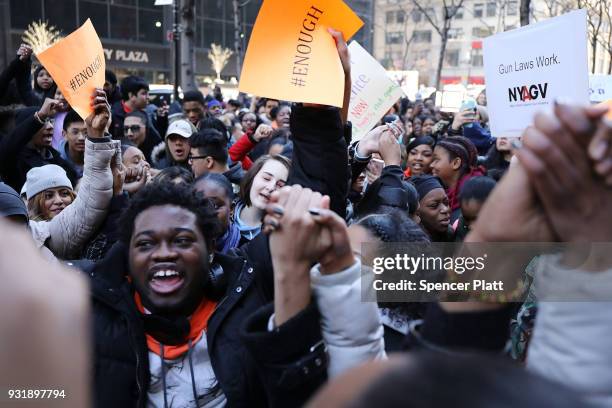 Students from surrounding schools gather at Zuccotti Park in lower Manhattan to mark one month since the high school shooting in Parkland, Florida...