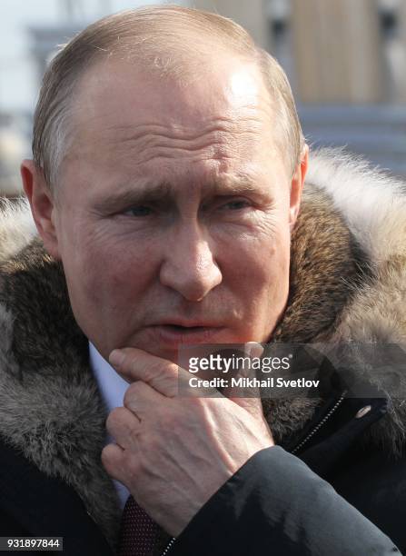 Russian President Vladimir Putin visits the construction site for the Crimean bridge which is being built to connect the Krasnodar region of Russia...