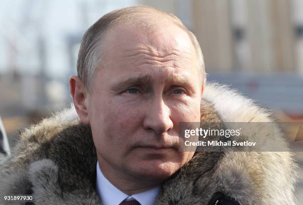 Russian President Vladimir Putin visits the construction site for the Crimean bridge which is being built to connect the Krasnodar region of Russia...