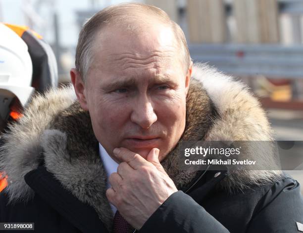 Russian President Vladimir Putin visits the construction site for the Crimean bridge which is being built to connect the Krasnodar region of Russia...