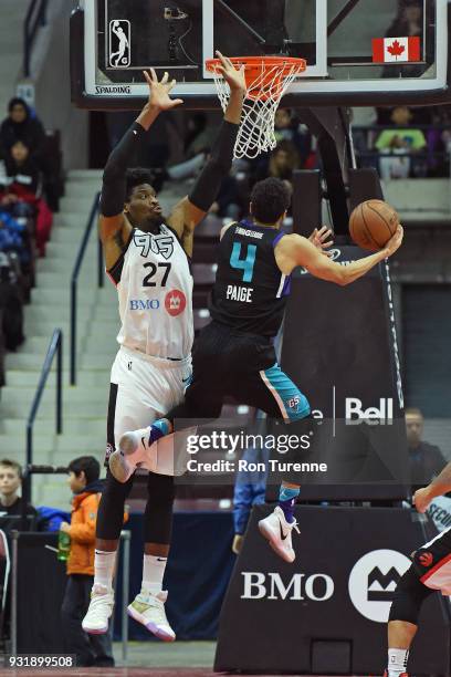 Marcus Paige of the Greensboro Swarm drives to the basket while guarded by Shevon Thompson of the Raptors 905 during the NBA G-League game at the...