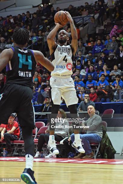 Lorenzo Brown of the Raptors 905 shoots the ball against the Greensboro Swarm during the NBA G-League game at the Hershey Centre in Mississauga,...