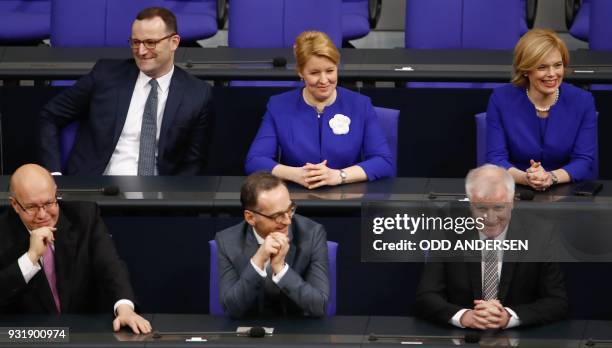 Ministers of Germany's new government have taken seat on the government's bench following a swearing-in ceremony during a session at the Bundestag on...