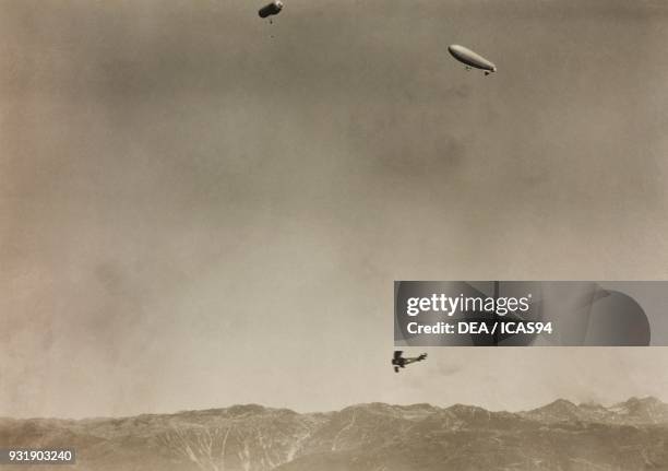 Biplane and two airships at the Nastro Azzurro ceremony, July 22 Aviano, World War I, Italy, 20th century.