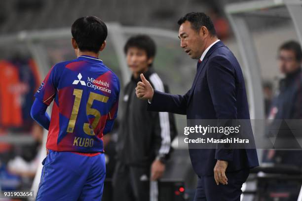 Kenta Hasegawa,coach of FC Tokyo speaks to Takefusa Kubo during the J.League YBC Levain Cup Group A match between FC Tokyo and Albirex Niigata at...