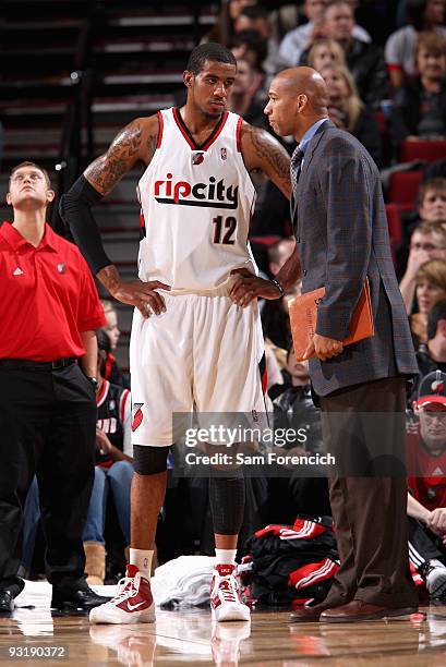 LaMarcus Aldridge listens to assistant coach Monty Williams of the Portland Trail Blazers during the game against the San Antonio Spurs on November...