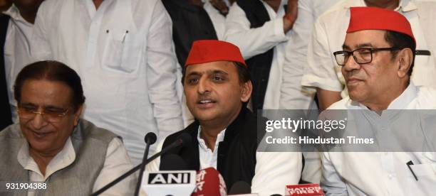 Samajwadi Party chief Akhilesh Yadav with senior party leaders Kiranmoy Nanda and Azam Khan addressing a press conference after phenomenal victory in...