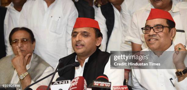 Samajwadi Party chief Akhilesh Yadav with senior party leaders Kiranmoy Nanda and Azam Khan addressing a press conference after phenomenal victory in...