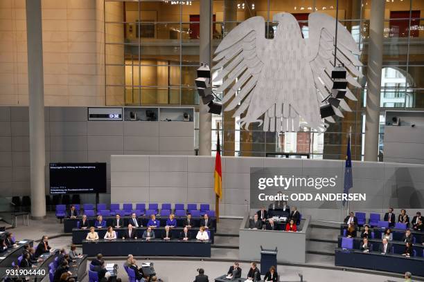 Ministers of Germany's new government have taken seat on the government's bench following a swearing-in ceremony during a session at the Bundestag on...