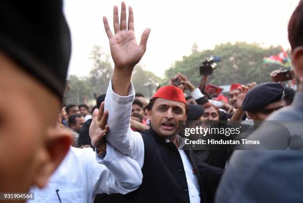 Samajwadi Party chief Akhilesh Yadav with party leaders arrives to address a press conference after phenomenal victory in Uttar Pradesh's...