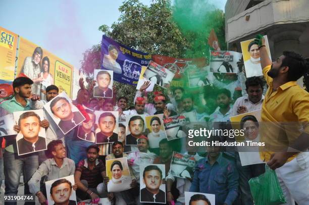 Samajwadi Party workers celebrate the success of their party in the Lok Sabha bypoll elections at Lahurabir Azad Park, on March 14, 2018 in Varanasi,...