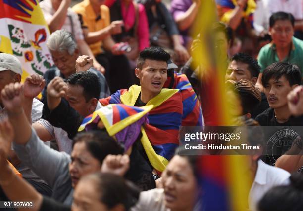 Tibetan people gather for peaceful protest against China government during the 10th Anniversary of Tibetan Uprising at Parliament Street near Jantar...