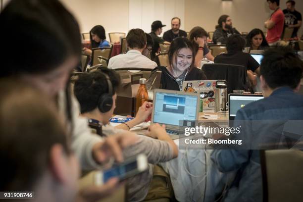 Attendees participate in a hack-a-thon during the South By Southwest conference in Austin, Texas, U.S., on Tuesday, March 13, 2018. Amid the raucous...