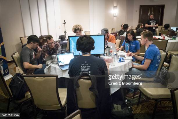 Attendees participate in a hack-a-thon during the South By Southwest conference in Austin, Texas, U.S., on Tuesday, March 13, 2018. Amid the raucous...