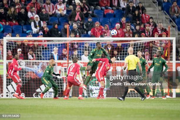 March 10: Larrys Mabiala of Portland Timbers heads clear while challenged by Aurelien Collin of New York Red Bulls during the New York Red Bulls Vs...