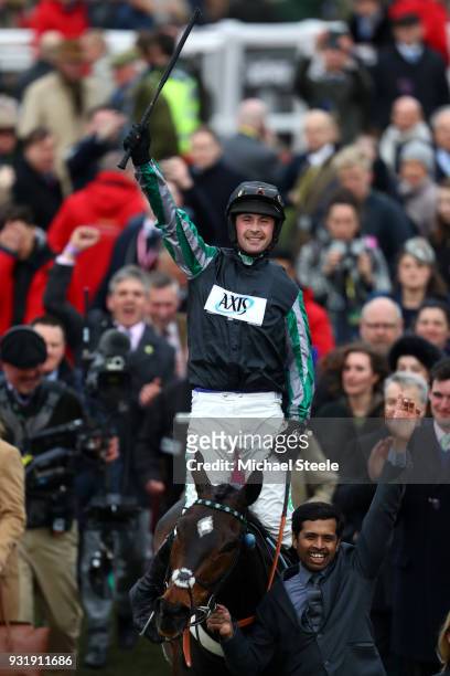 Nico de Boinville on Altiorcelebrates winning the Betway Queen Mother Champion Chase during Cheltenham Festival Ladies Day at Cheltenham Racecourse...