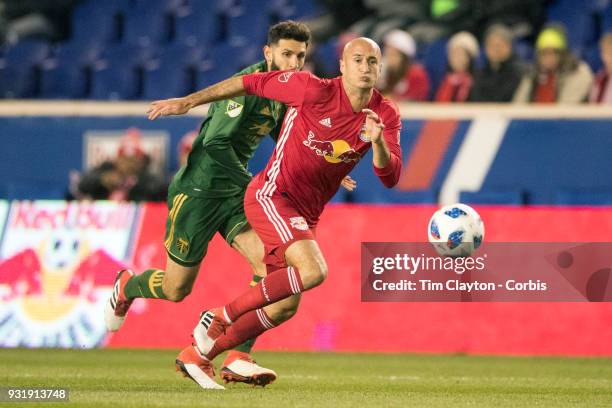 March 10: Aurelien Collin of New York Red Bulls challenged by Diego Valeri of Portland Timbers during the New York Red Bulls Vs Portland Timbers MLS...