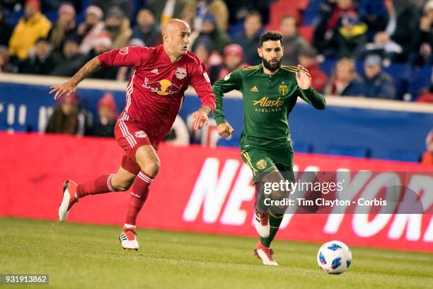 March 10: Aurelien Collin of New York Red Bulls challenged by Diego Valeri of Portland Timbers during the New York Red Bulls Vs Portland Timbers MLS...