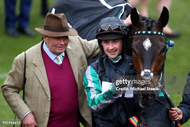 Nicky Henderson and Nico de Boinville celebrate after winning the Betway Queen Mother Champion Chase with Altior during Cheltenham Festival Ladies...