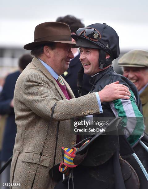 Cheltenham , United Kingdom - 14 March 2018; Trainer Nicky Henderson, left, with jockey Nico de Boinville after winning the Betway Queen Mother...