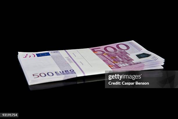 a stack of five hundred euro bills - five hundred euro banknote stock pictures, royalty-free photos & images