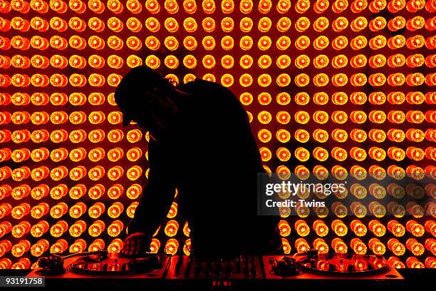a dj playing records at nightclub - dj club foto e immagini stock