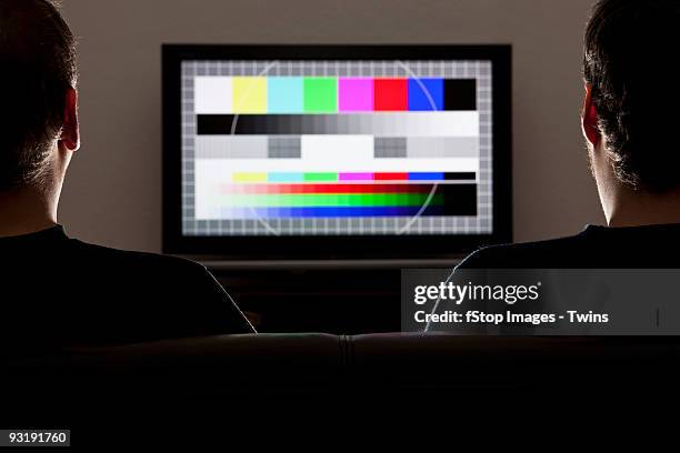 two men watching a test pattern on a television - wide screen stock pictures, royalty-free photos & images