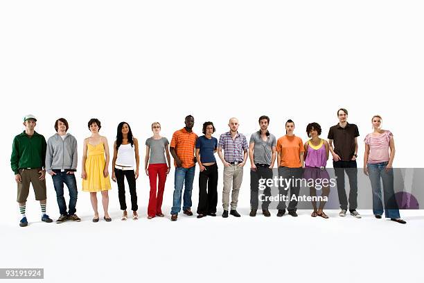 a group of young adults standing in a row - um do lado do outro - fotografias e filmes do acervo