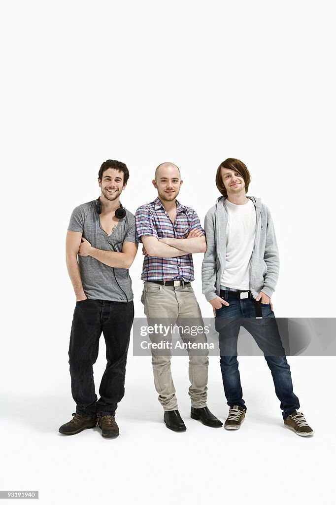 Three men standing together